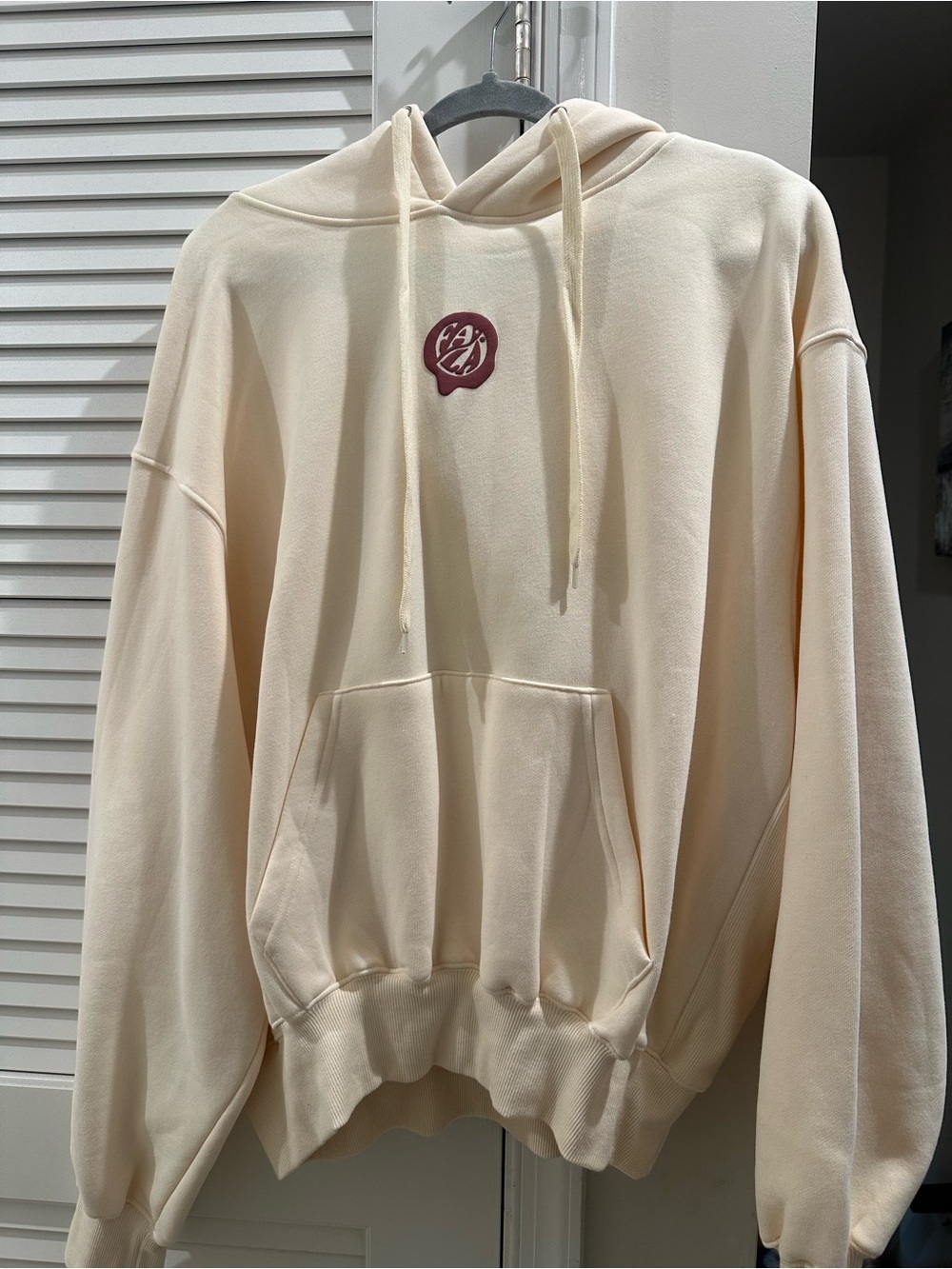 Cream Womens Pullover Hoodie with Chest Emblem